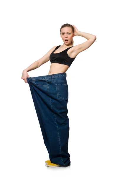 Dieting concept with big jeans on white — Stock Photo, Image