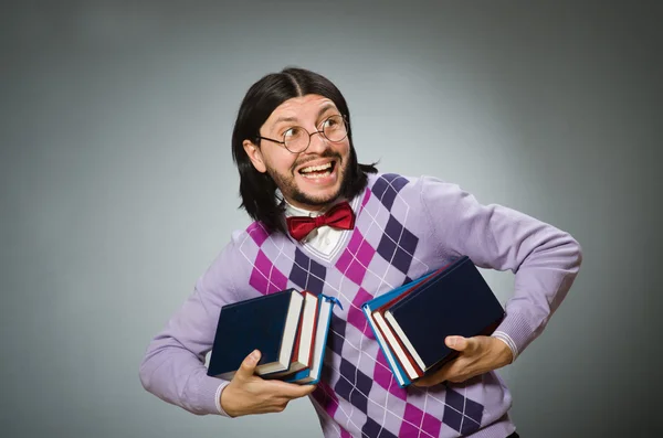 Joven estudiante con libro en concepto de aprendizaje —  Fotos de Stock