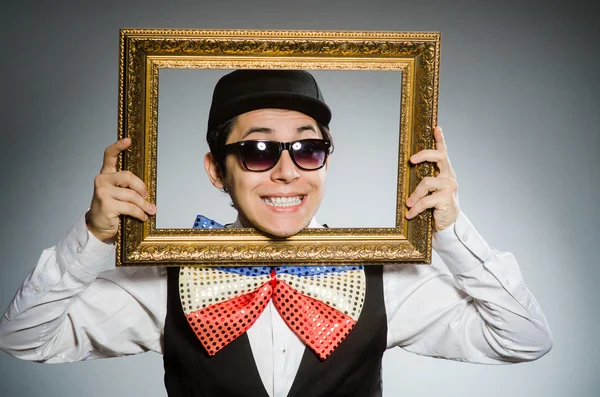 Funny man with picture frame — Stock Photo, Image