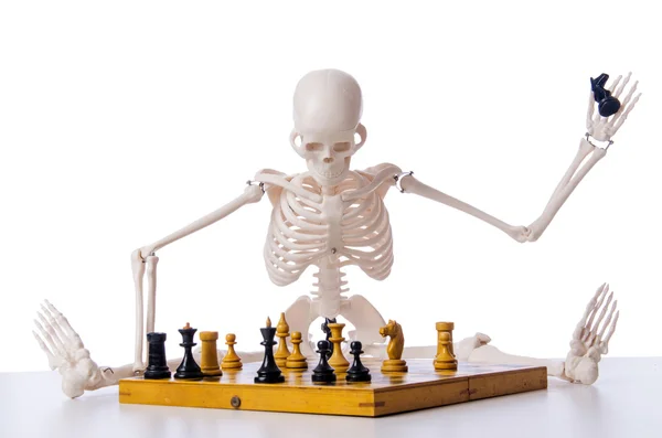 Skeleton scratches head trying to figure out next chess move Stock Photo -  Alamy