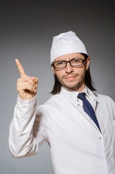 Young serious medical worker pointing — Stock Photo, Image