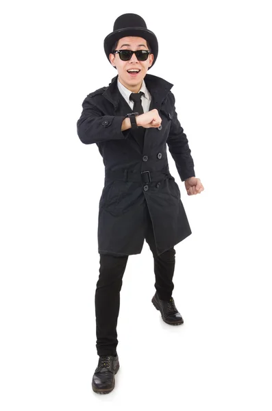Mladý detektiv v černém plášti izolovaný na bílém — Stock fotografie