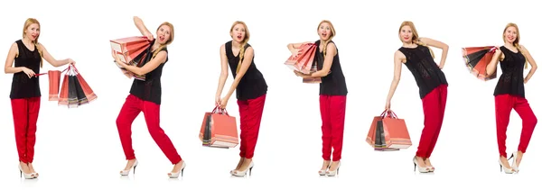 Ensemble de femme avec sacs à provisions sur blanc — Photo