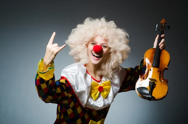 Clown in funny concept on dark background — Stock Photo, Image