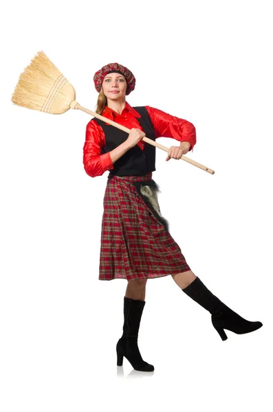 Femme drôle en vêtements écossais avec balai — Photo