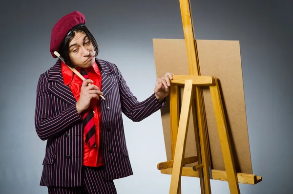 Funny artist with his artwork — Stock Photo, Image