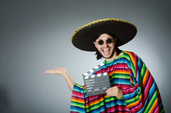 Mexican man with movie board — Stock Photo, Image