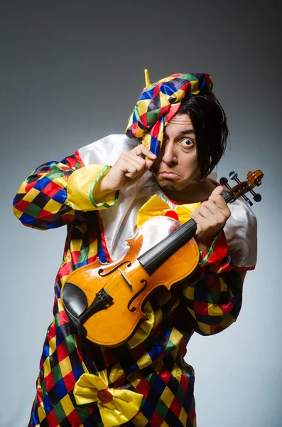 Funny violin clown player in musical concept — Stock Photo, Image