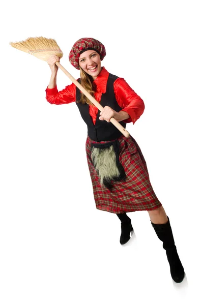 Funny woman in scottish clothing with broom — Stock Photo, Image