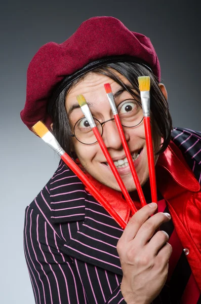 Funny artist with his artwork — Stock Photo, Image