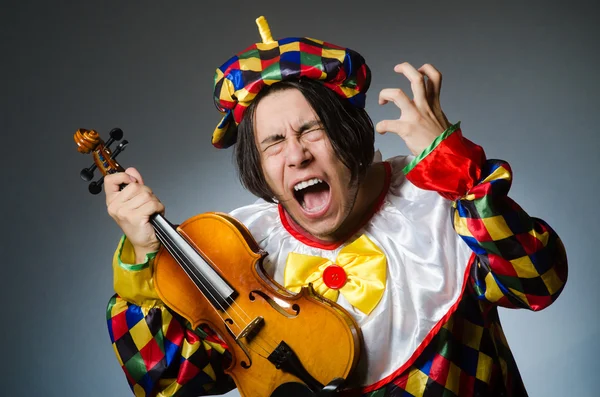 Funny violin clown player in musical concept — Stock Photo, Image