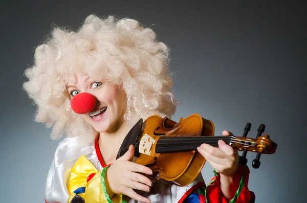 Clown in funny concept on dark background — Stock Photo, Image