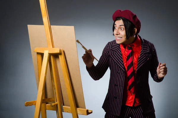 Funny artist with his artwork — Stock Photo, Image