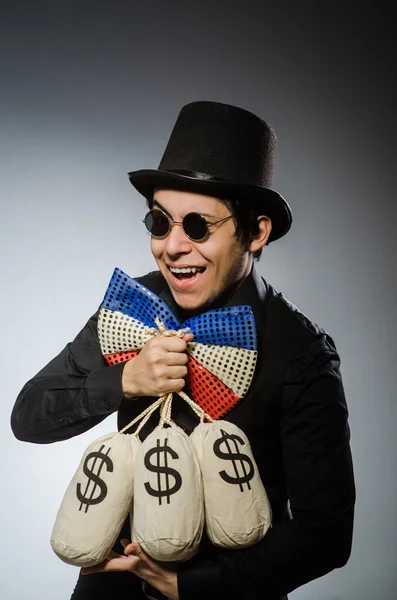 Homem engraçado com dinheiro sacos de dólar — Fotografia de Stock