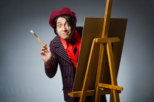 Funny artist with his artwork — Stock Photo, Image