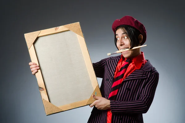 Funny artist with his artwork — Stock Photo, Image