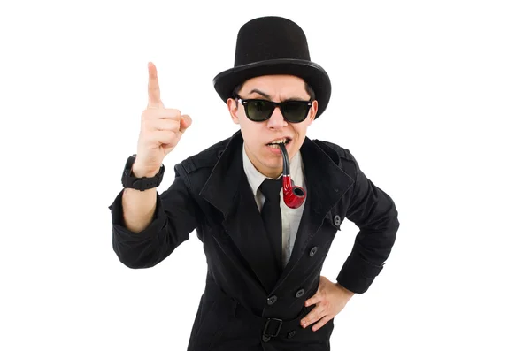 Young detective in black coat holding magnifying glass isolated — Stock Photo, Image