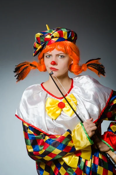 Clown in funny concept on dark background — Stock Photo, Image