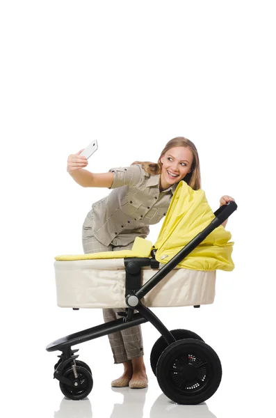 Woman with baby and pram isolated on white — Stock Photo, Image