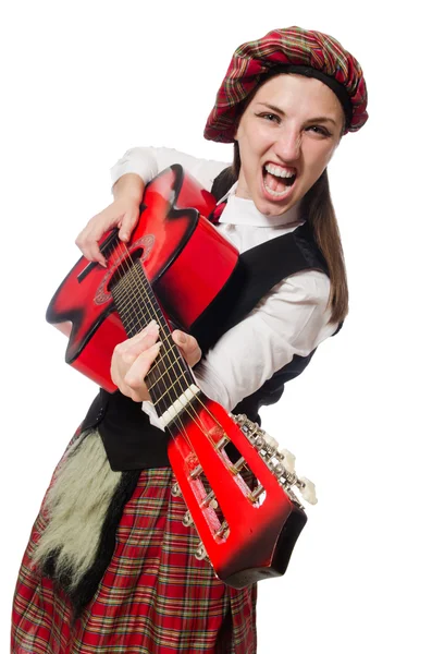 Woman in scottish clothing with guitar — Stock Photo, Image