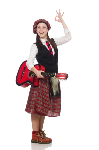 Žena ve skotské oblečení s kytarou — Stock fotografie