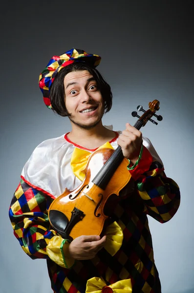 Funny violin clown player in musical concept — Stock Photo, Image