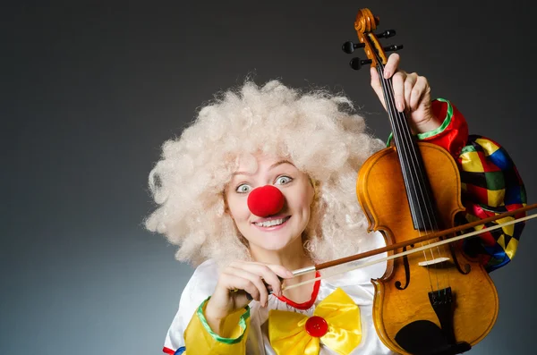 Clown in funny concept on dark background — Stock Photo, Image