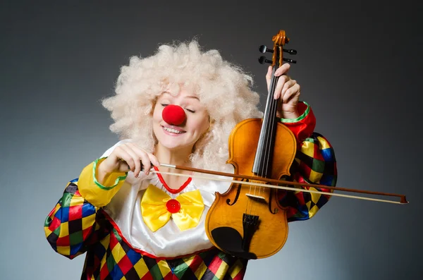 Clown in funny concept on dark background — Stock Photo, Image