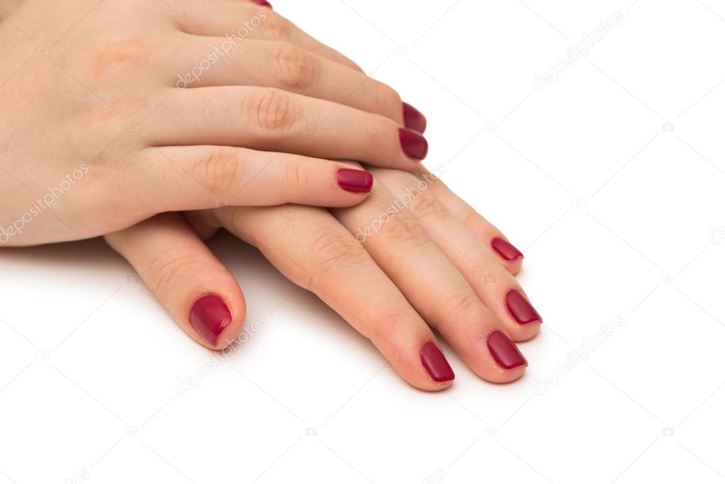 Woman hands with red nail isolated on white