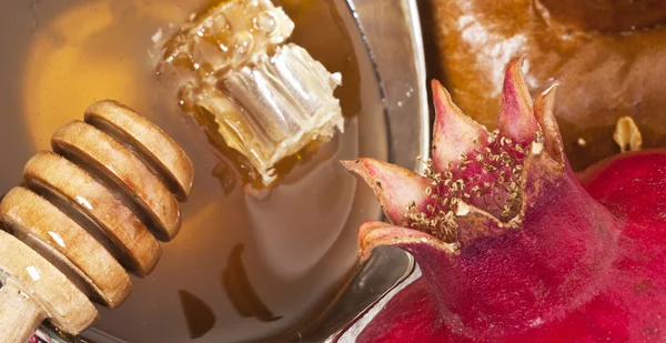 Pomegranates and honey — Stock Photo, Image