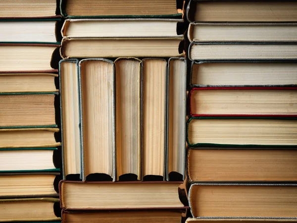 Background made of old books arranged in stacks