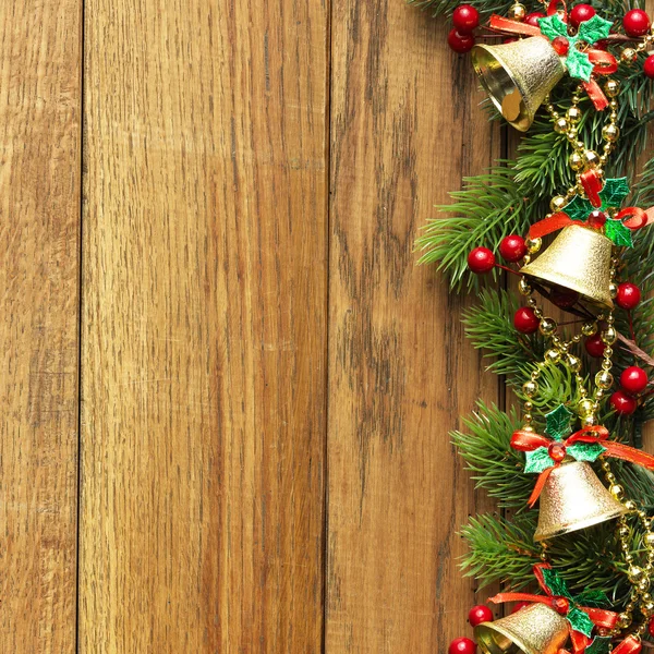 Decorated Christmas tree border on wood paneling