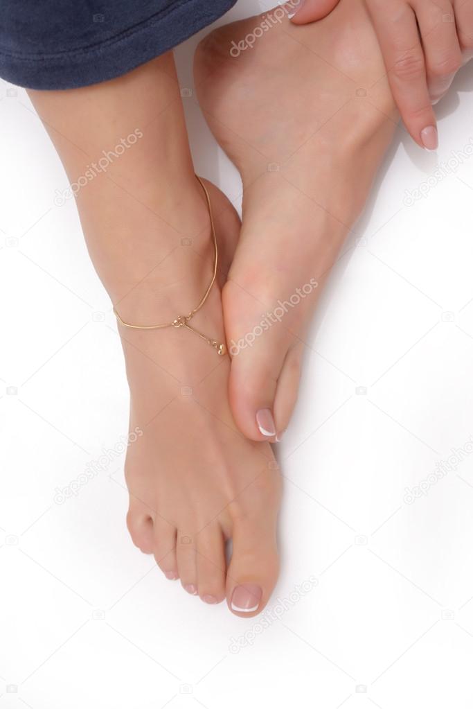 Beautiful female feet at spa salon