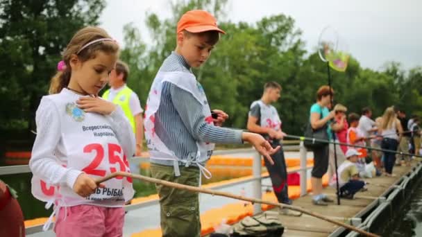 Children fishing at Fishermans Day — Stock Video