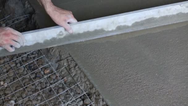 Hand of worker making screed — Stock Video