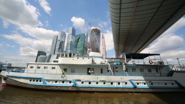 Ship floats and skyscrapers — Stock Video