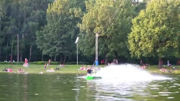 Wakeboarder with helmet jumping ond — Stock Video