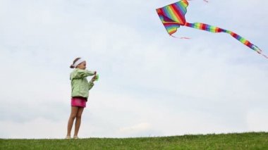 Little girl with colored kite 