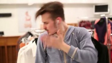 Young dancer dances near hangers