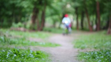 brother and sister riding bicycle