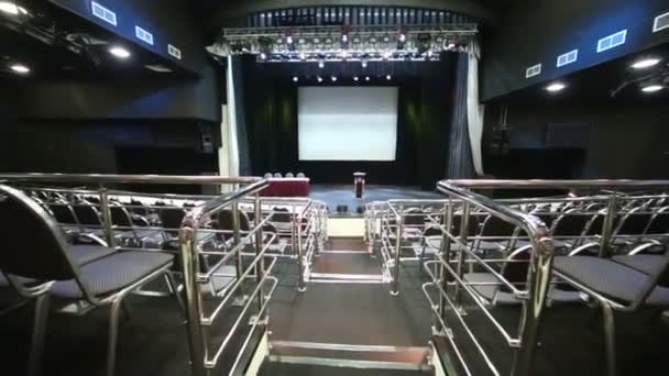 Empty illuminated auditorium and stage — Stock Video