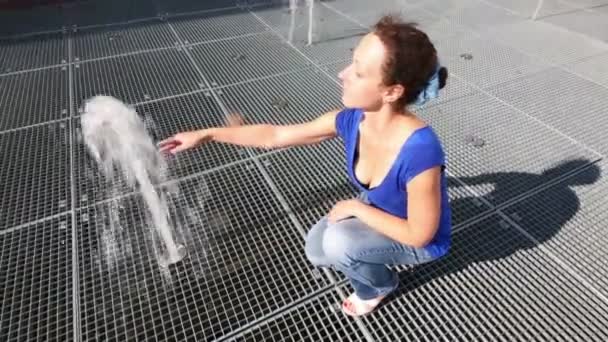 Woman touches water — Stock Video