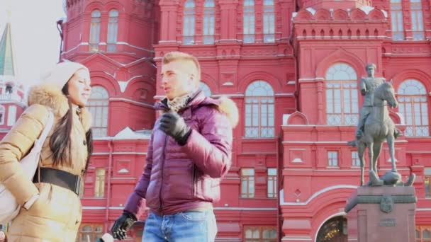 Man and woman  near red building — Stock Video