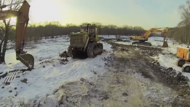 Bulldozer and excavators near road — Stock Video