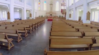  Rows of wooden pews and chancel 