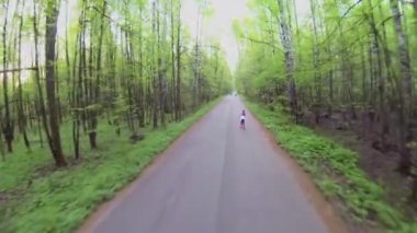 Little girl ride on rollerskates
