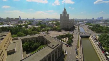 Cityscape with traffic on bridge over Jauza river 