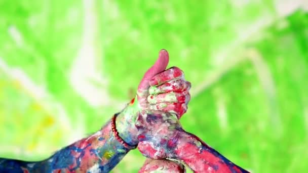 Manos pintadas en diferentes colores — Vídeos de Stock