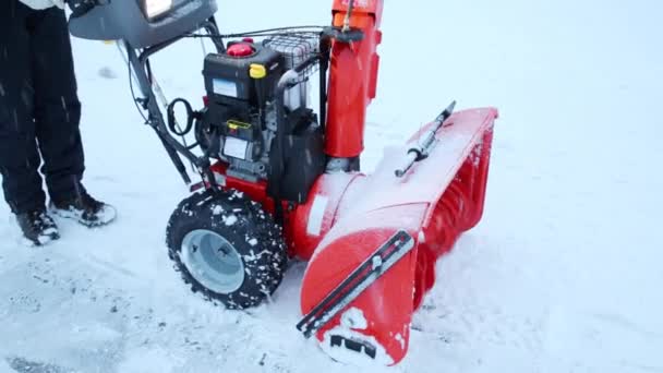 Man removes snow using a snowplow — Stock Video