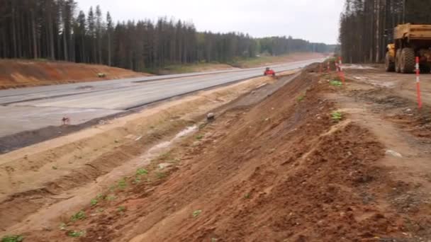 Lugar de construcción de la nueva carretera — Vídeo de stock